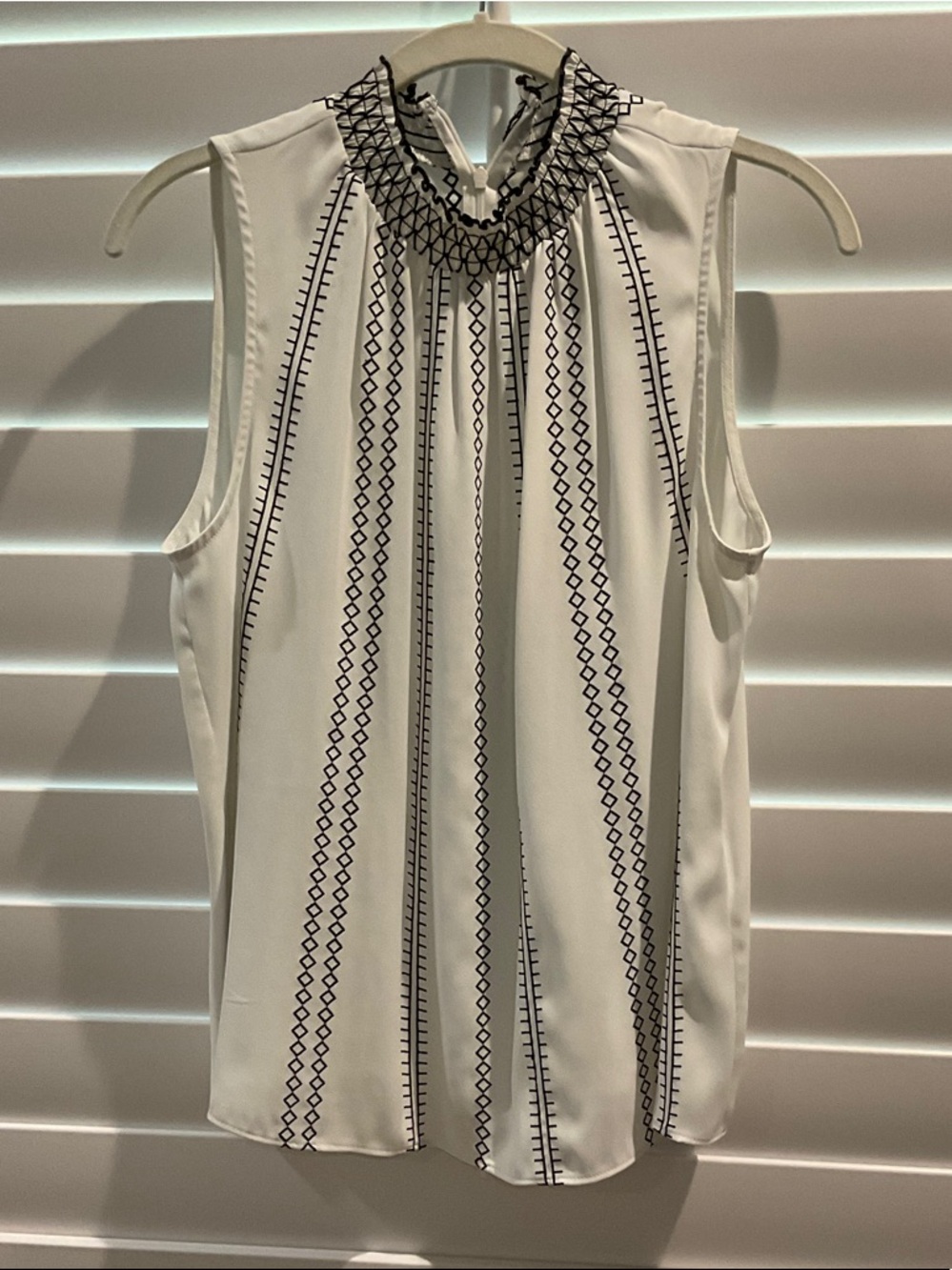 Sleeveless White Mock-Neck Top with Black Geo Stripe